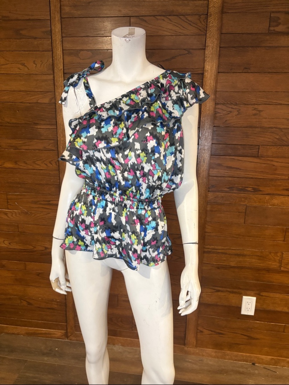 2B Bebe One-Shoulder Ruffle Peplum Top in Black Multicolor Print